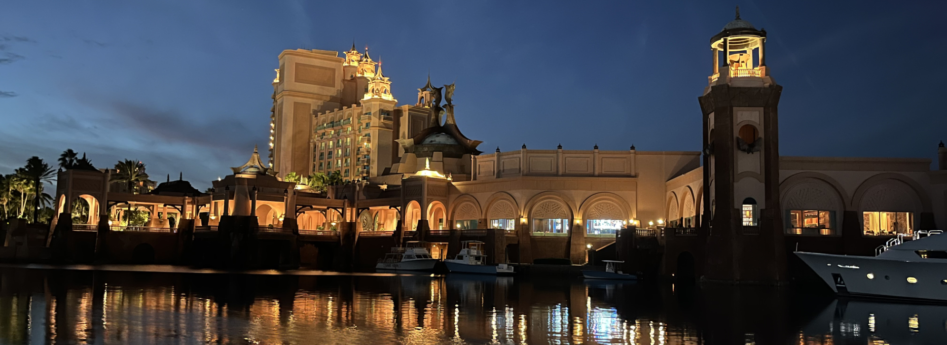 Independent Yacht Brokers for Locations Around The World - waterside view of a country at night.